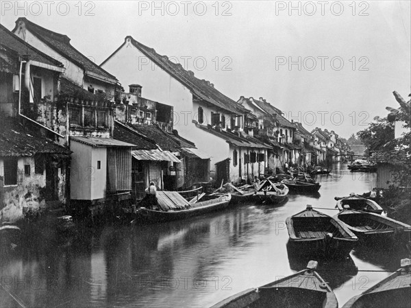 Small boats on the village canal in Java