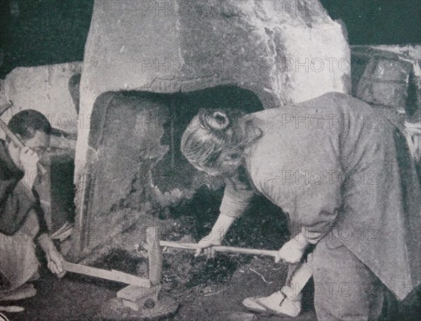 Japanese foundry showing husband and wife working at a forge. 1890