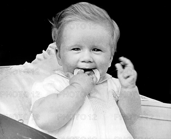 Teething baby with a teeth ring