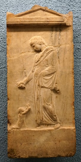 Marble tombstone depicting a woman leaving her child