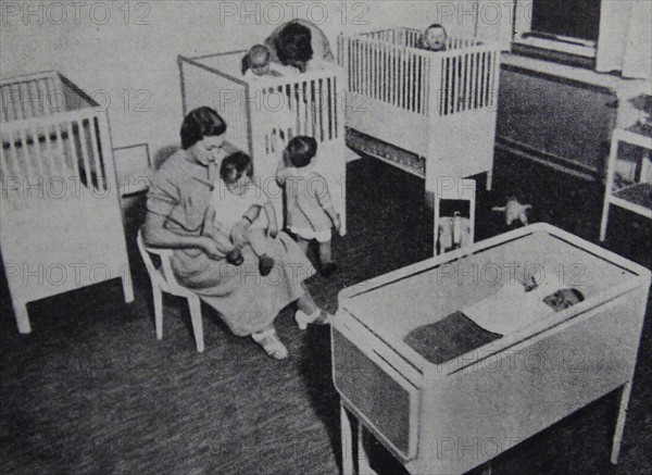 Photograph of nurses caring for children and infants at a child care centre