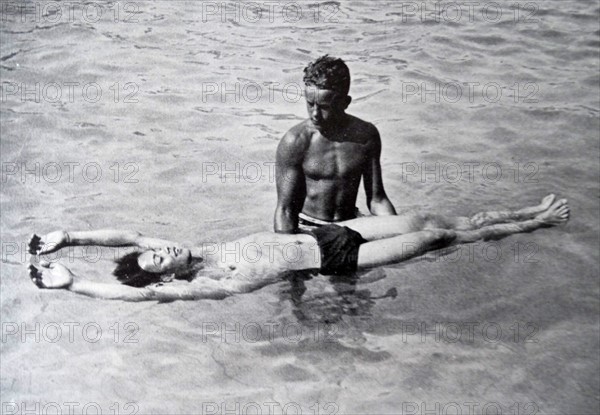 Young man learning to swim at Flatenbadet