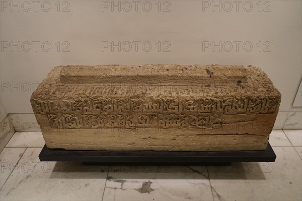 Crested grave cover with inscription