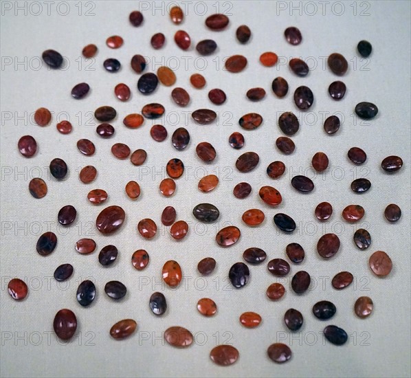 Engraved carnelian gems awaiting to be set into rings