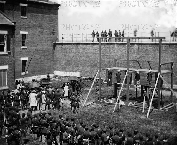 Hanging hooded bodies of the four conspirators