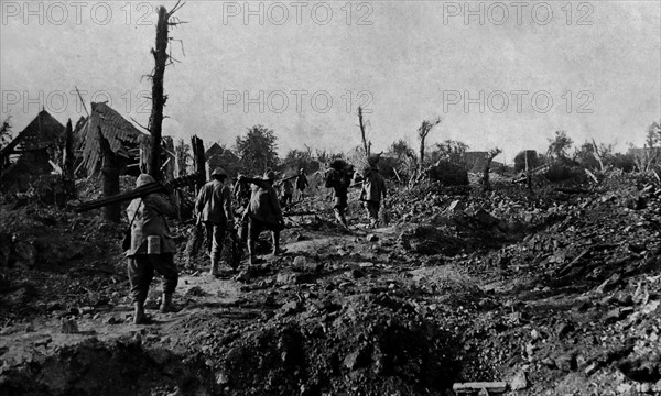 The remains of Dompierre as French forces pass through.