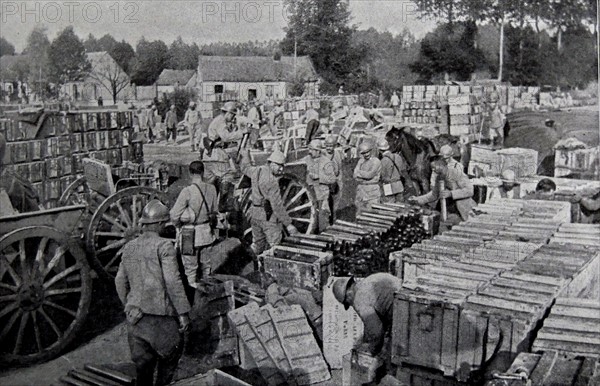 French soldiers load cases of supplies and ammunition.