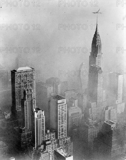 Smog obscures view of Chrysler Building from Empire State Building, New York City