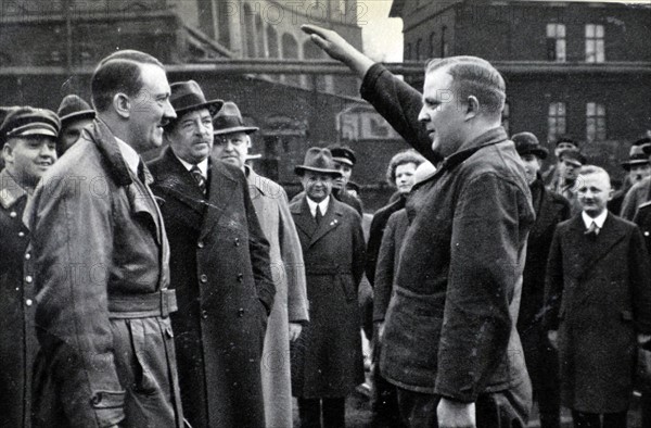 Adolf Hitler greets German labourers