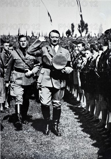 Adolf Hitler, salutes Hitler Youth Rally