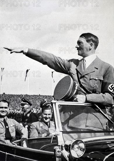 Adolf Hitler, salutes Hitler Youth Rally