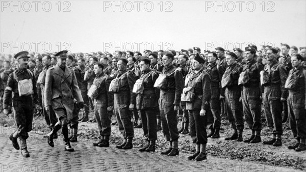 King George VI of Britain greeted by British soldiers in France