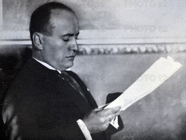 Mussolini reads the Treaty of Conciliation between Church and State