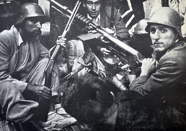 republican fighters shelter behind a barricade during the Spanish civil war 1937