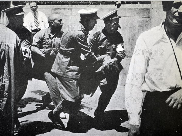 casualty from street fighting arrives at a Barcelona hospital during the Spanish civil war 1938