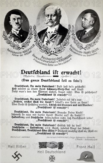 Germany is awakened!' a propaganda postcard