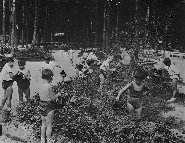 Nursery school children out of doors