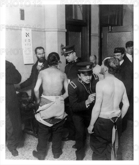 Physicians examining a group of Jewish immigrants