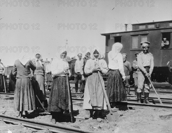 Russian women work on railway tracks