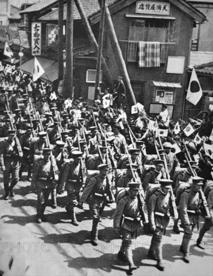 Celebratory parade by Japanese soldiers before embarkation to Manchuria