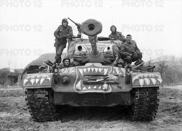 Photograph of Soldiers Sat on a Painted M-46 Tank