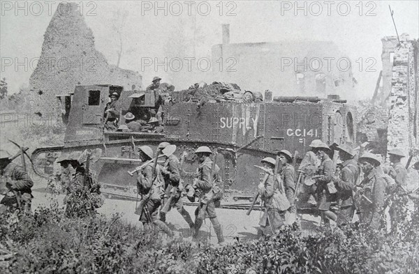 British soldiers march through a village in Northern france at the beginning of WWI