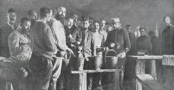 french soldiers take soup in a German camp in WWI