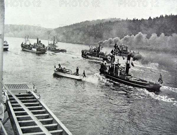 Norwegian boats escort the ship carrying the royal family into Oslo