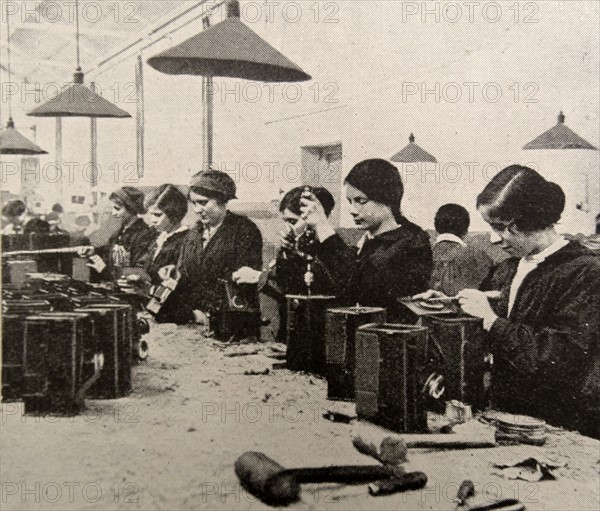 Women doing war work. Assembling naval signal lamps; England during WWI 1916