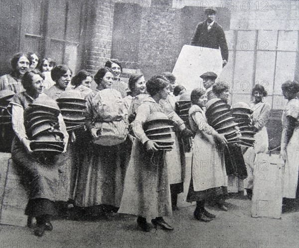 Loading soldiers helmets for delivery to the front line