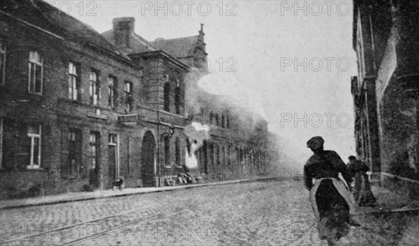 French civilians run as their town is shelled by German artillery. 1915 WWI