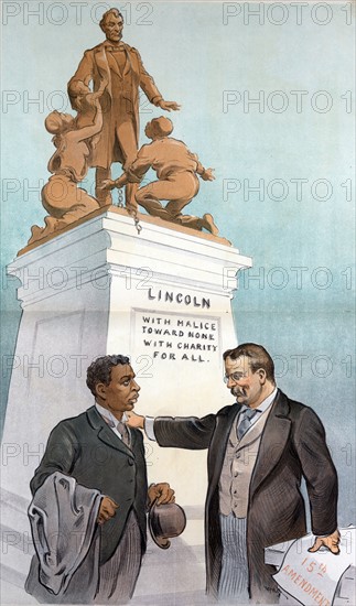 President Theodore Roosevelt, standing with right hand on the left shoulder of an African American man