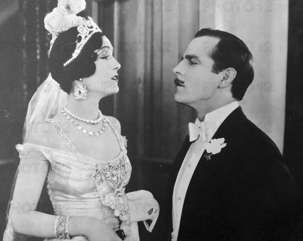 Hauteur at its height.  The studio caption says "Lord St. Austel (Antonio Moreno) tells his bride (Pauline Starke) that she has discredited the family name, in a scene from Love's Blindness, 1926, an Elinor Glyn production for Metro-Goldwyn-Mayer.