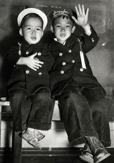 Japanese children waiting for a bus