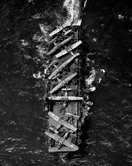 Planes aboard the deck of the USS Thetis Bay