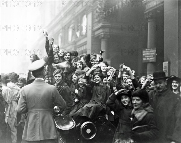 London; England. crowds celebrate the Armistice at the end of WWI 1918