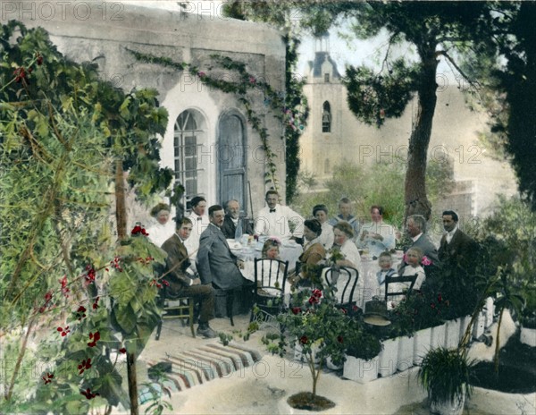 Hand-coloured photograph of The American Colony