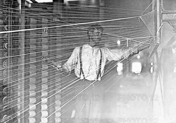 Photograph of a wrapper working at his machine