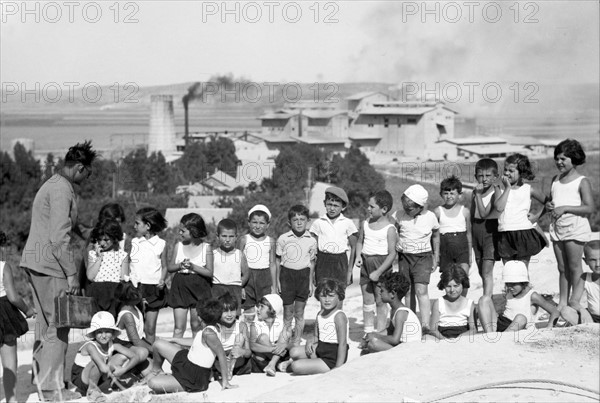 Photograph of Jewish School children on Carmel slope in the background