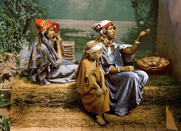 Colour photograph of Bedouin beggars and children