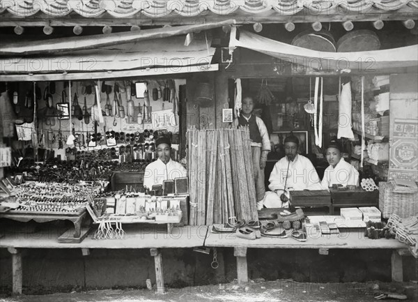 Photograph of Korean shopkeepers at their stores