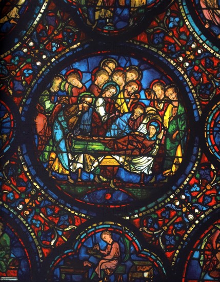 Stained glass window from the south aisle in Chartres Cathedral, France. death of the Virgin