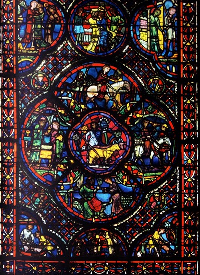 window from Bourges Cathedral, France. Shows the parable of the prodigal son;