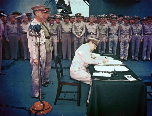 General Douglas MacArthur signing the Instrument of Surrender on behalf of the Allied Powers 1945