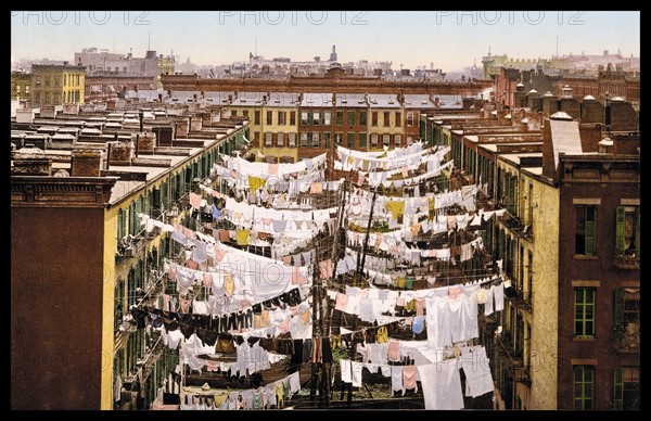 San Francisco street scene showing washing drying between tenement buildings 1900