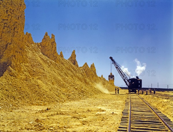 Nearly exhausted sulphur vat from which railroad cars are loaded