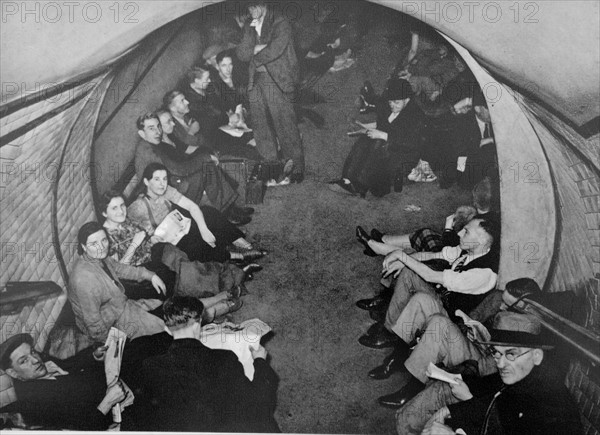 Civilians take shelter in a London Undergroud rail station during the air raids of the German Blitz 1940