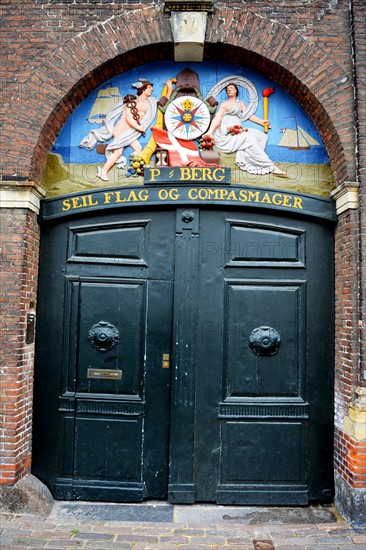 Old sign for a flag and compass maker in Copenhagen's Nyhaven area, Denmark