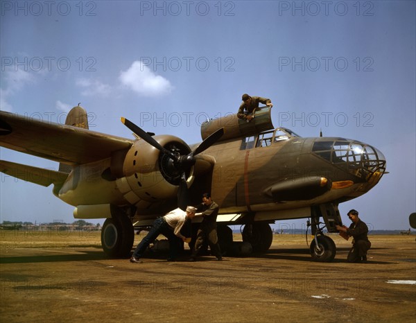 Colour photograph of the servicing of an A-20 bomber