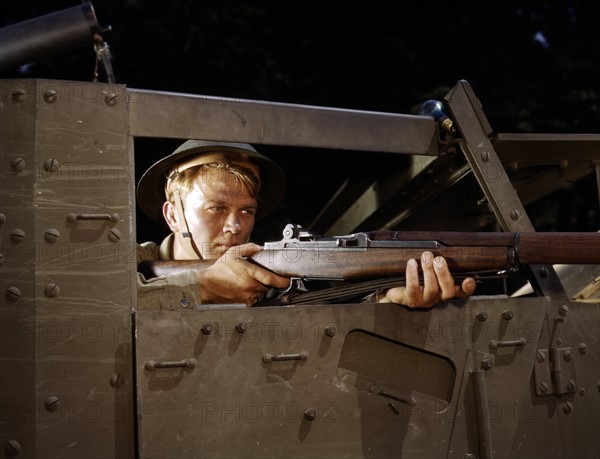 Colour photograph of an infantryman with a Garand rifle